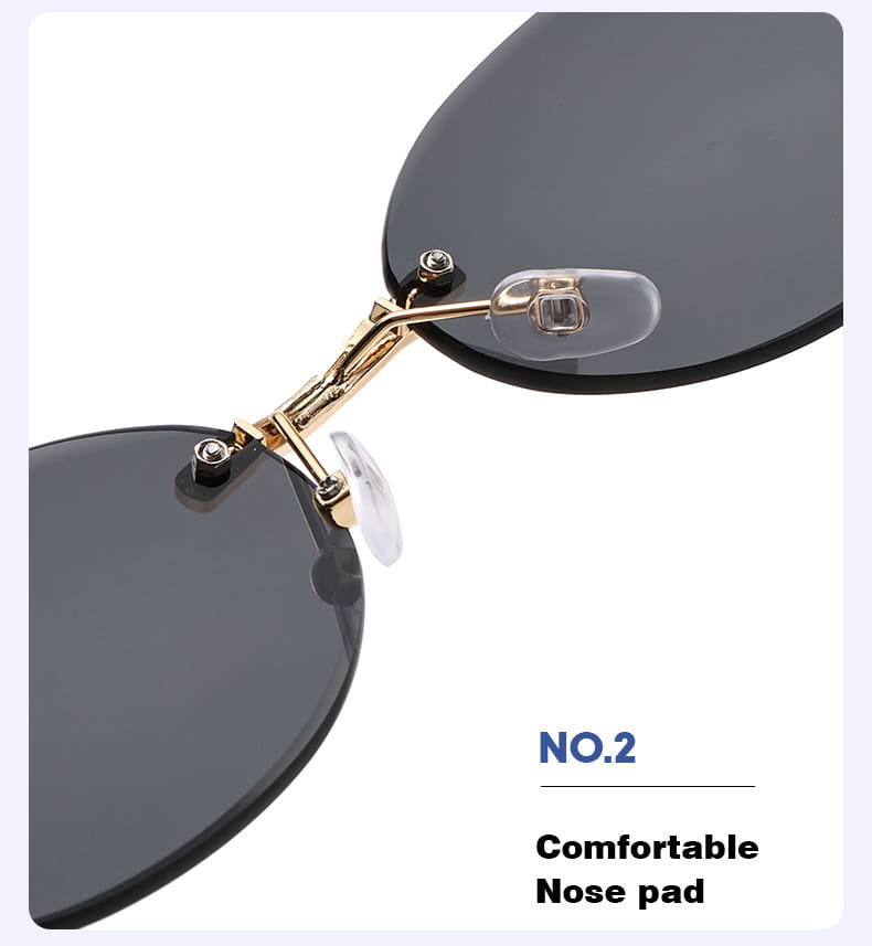 Frameless oval uv400 fashion sunglasses with gold-toned metal bridge, transparent nose pads, and dark gray round lenses.