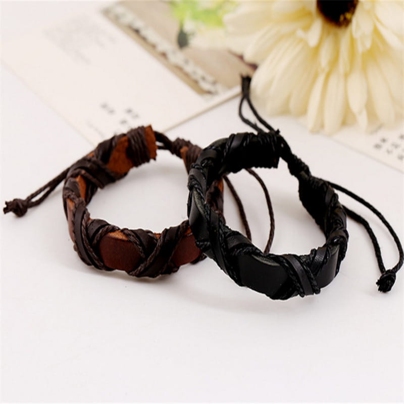 two braided leather bracelets from the asgard braided leather nordic bracelet set in black and brown with a contrasting tan accent