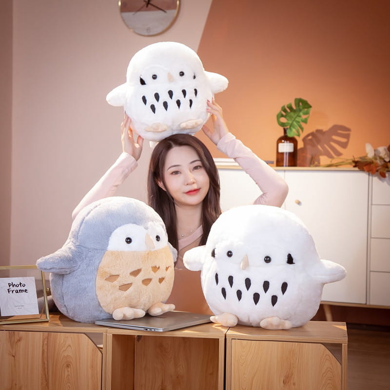 white plush owl stuffed animal featuring black eye patches and black teardrop patterns on its soft round belly designed as a doll toy