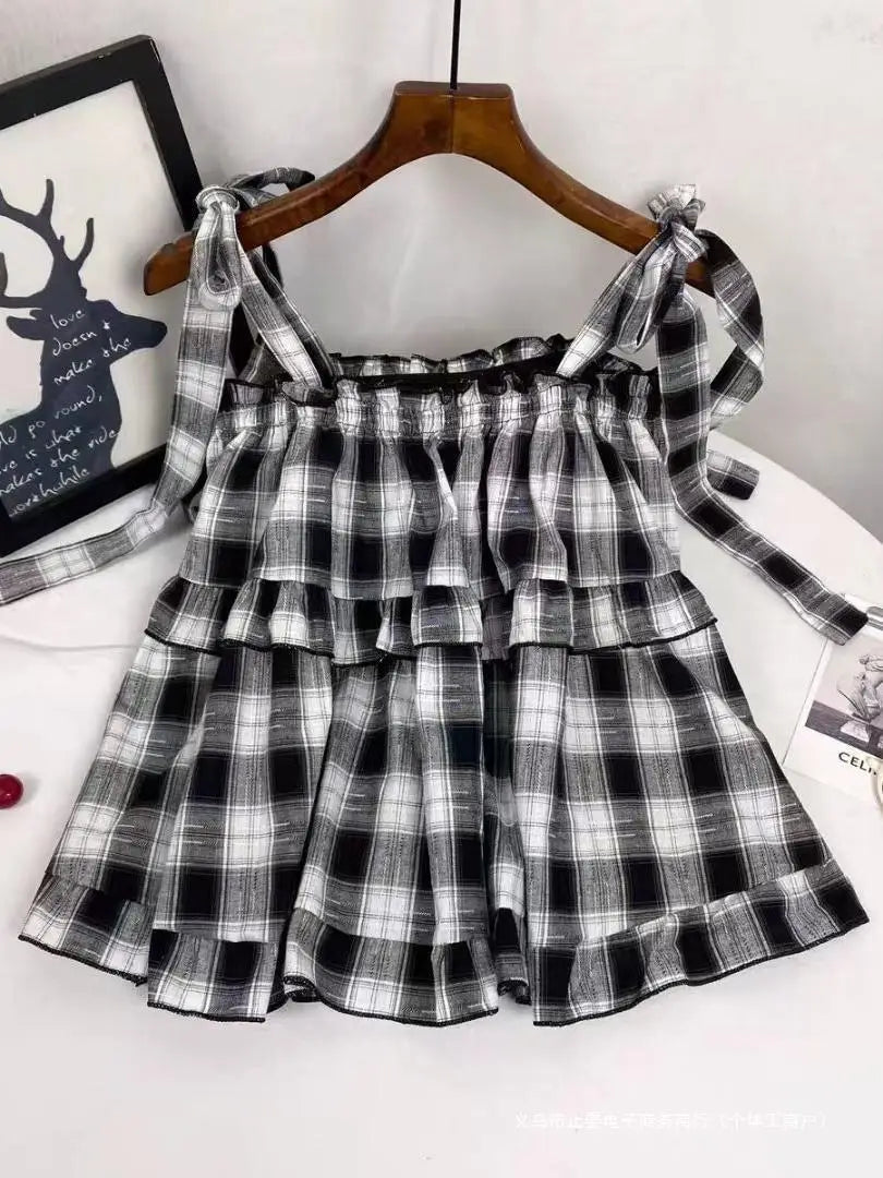black and white plaid tiered skirt with tied shoulder straps in cotton fabric suitable for casual wear