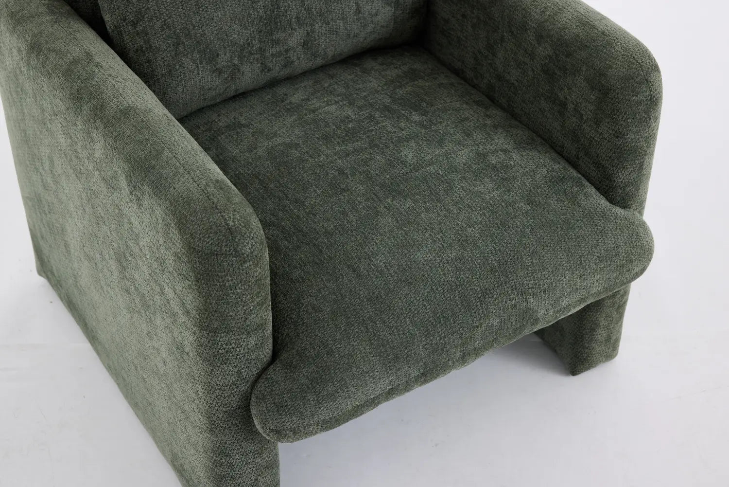 A boucle fabric accent chair featuring a plush olive-green velvet upholstery with soft textured fabric and rounded cushioned arms.