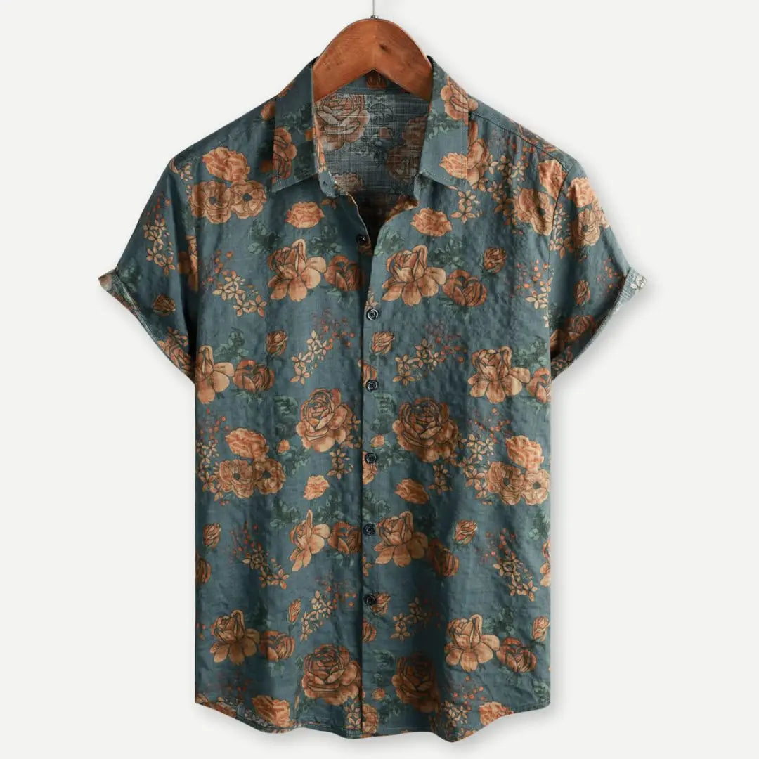 A teal floral Hawaiian short sleeve shirt for men featuring a vintage warm brown and orange floral pattern.