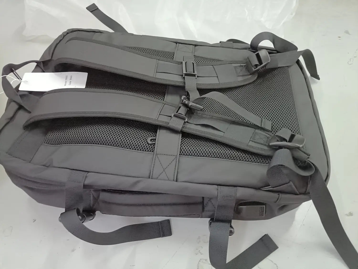 Dark gray Bange 16 inch waterproof nylon laptop travel backpack showing the back side with adjustable shoulder straps and mesh back panel