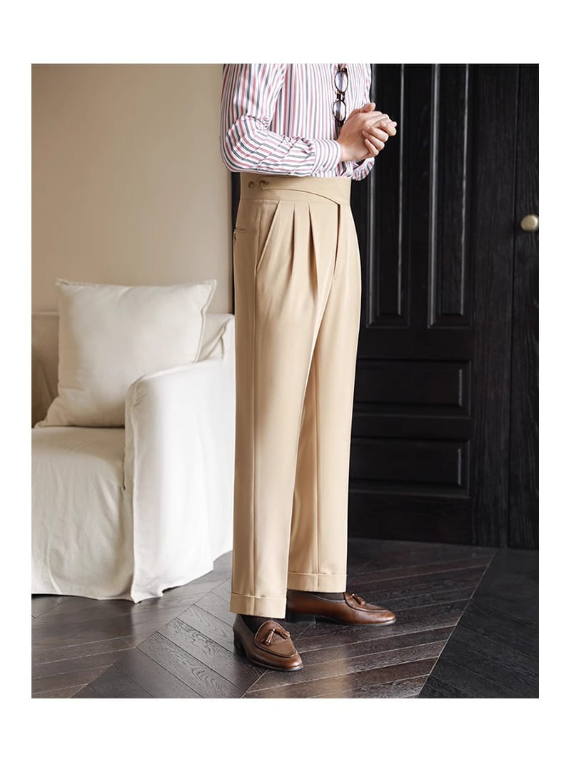 Beige tailored pleated wool trousers with a straight leg fit and belt loops for men.