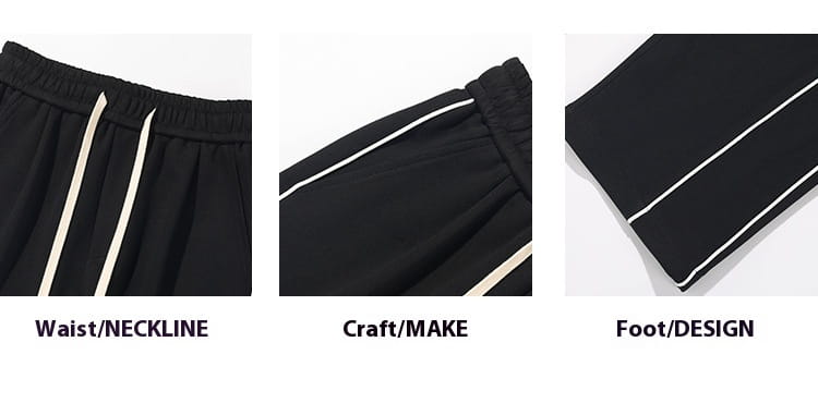 black wide leg striped track pants with white side stripes and elastic waistband made from breathable athletic fabric designed for comfortable sportswear use
