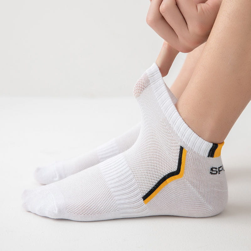 Men’s low cut athletic striped cotton socks 5 pack featuring white ankle socks with yellow and black accent stripe and ribbed cuff.