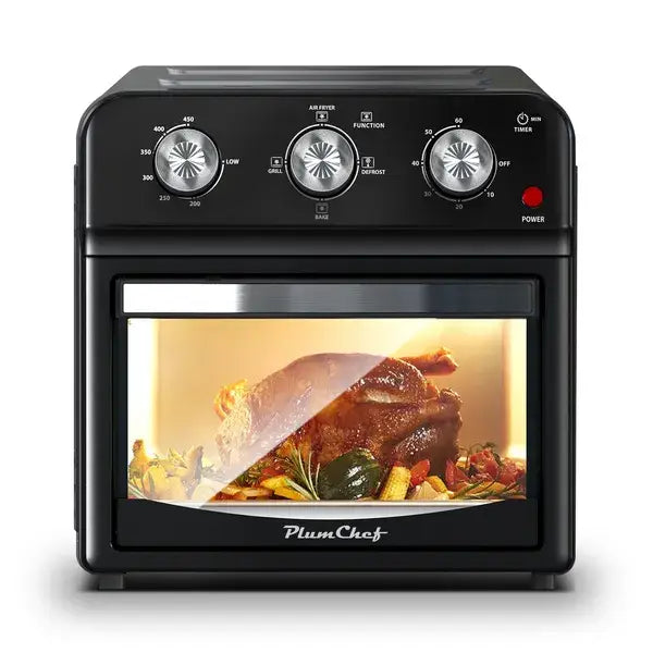 Black plumchef 12l multi function air fryer oven with glass door showing roasted chicken and vegetables inside.