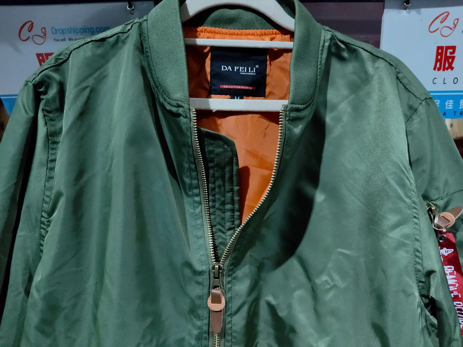 ma1 pilot bomber jacket in green da feili fabric with orange lining and a zipper pull designed for casual wear and featuring a stand collar.