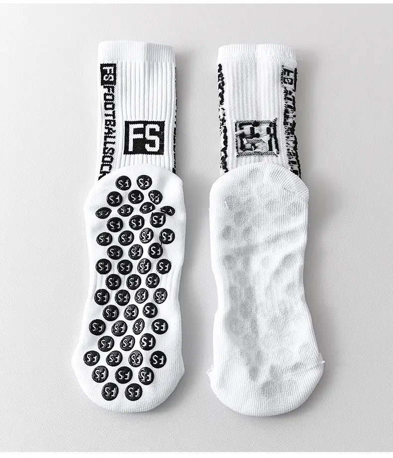 White athletic anti-slip football grip socks for men featuring black grip dots and fs branding on the footbed.
