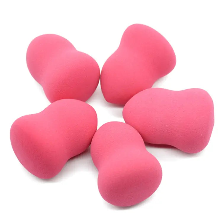 pink heart-shaped makeup sponges made of soft hydrophilic foam for applying makeup shown in a 2 pack.