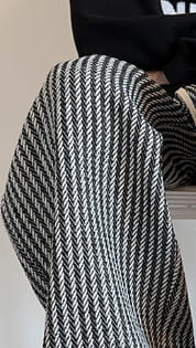 Men wide leg herringbone drawstring trousers in black and white pattern showcasing the front side.