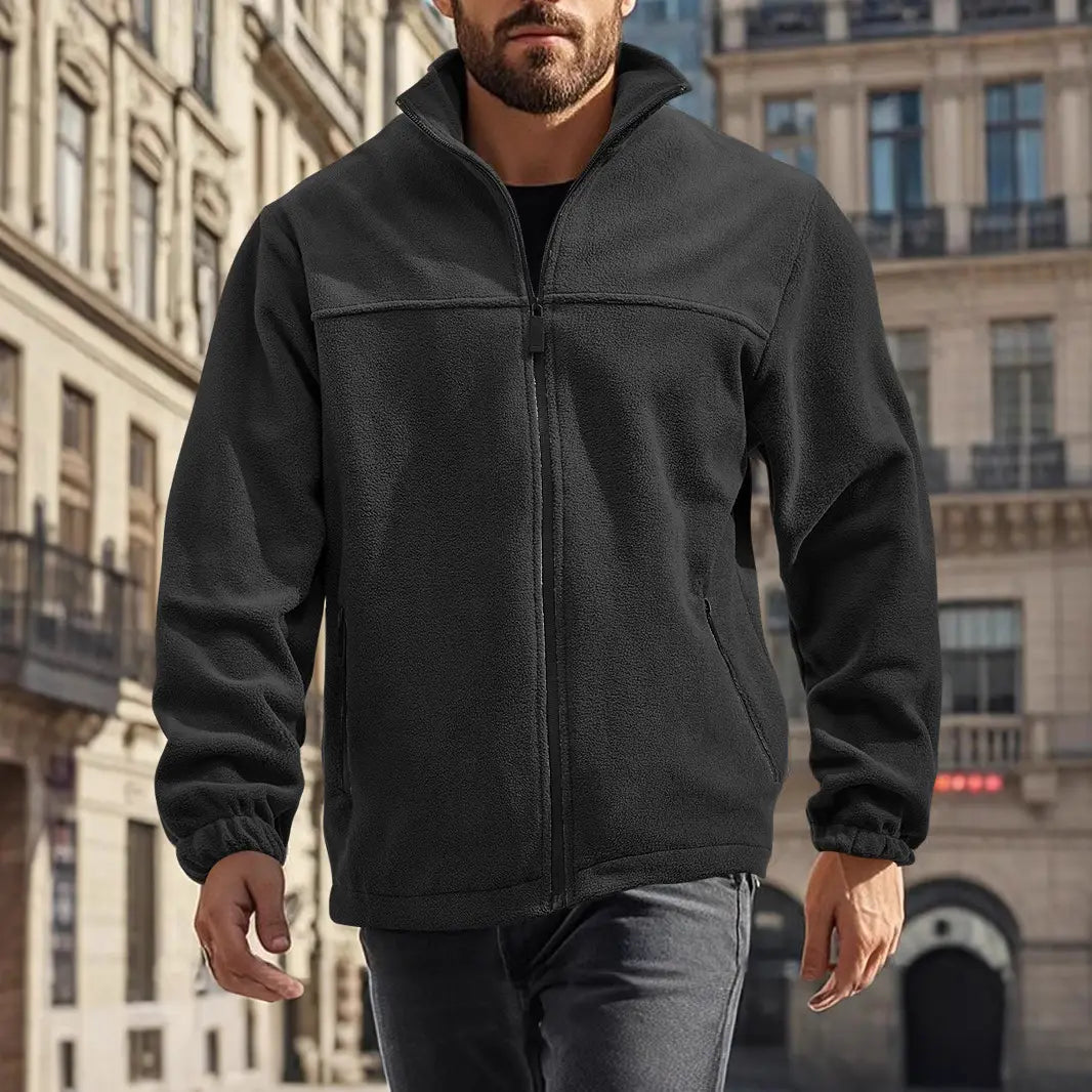 Chaqueta polar para hombre de cierre completo con cuello alto en color negro, con cuello alto y puños elásticos, confeccionada con material de forro polar suave
