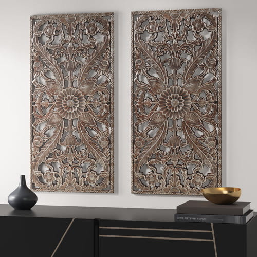 Pair of ornate metallic wall art panels featuring intricate floral and leaf carvings in a bronze or antiqued silver finish from the carved wood wall decor set distressed botanical panels.