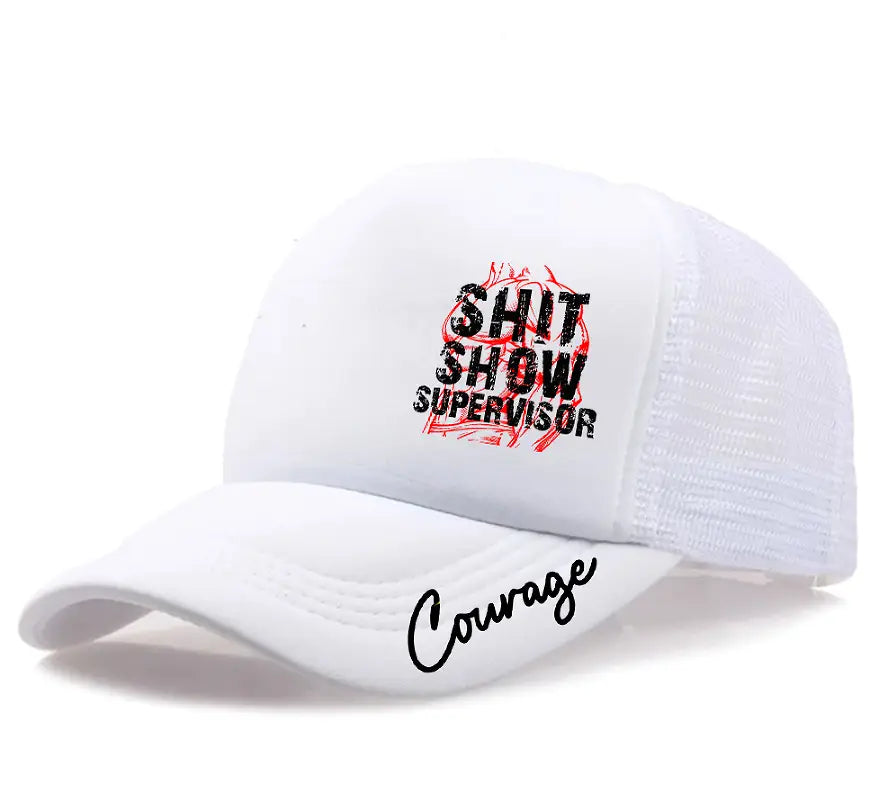 White trucker style mesh back cap with black and red embroidered text reading shit show supervisor on the front and courage in cursive script along the brim, novelty supervisor trucker hat.