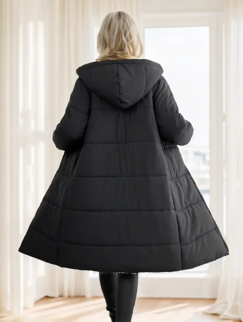 Black quilted hooded coat for women featuring a flared silhouette ideal for winter wear.