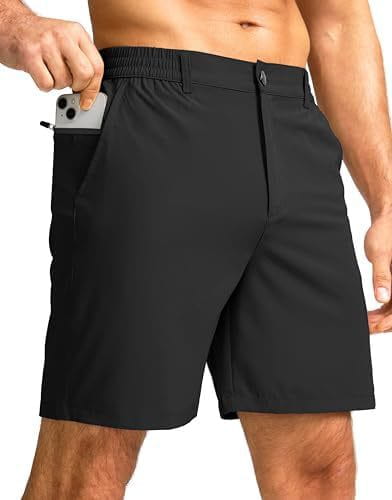 Short de sport extensible pour homme coupe slim vert foncé, avec taille à cordon de serrage et poches latérales, dont une permettant de transporter un smartphone.