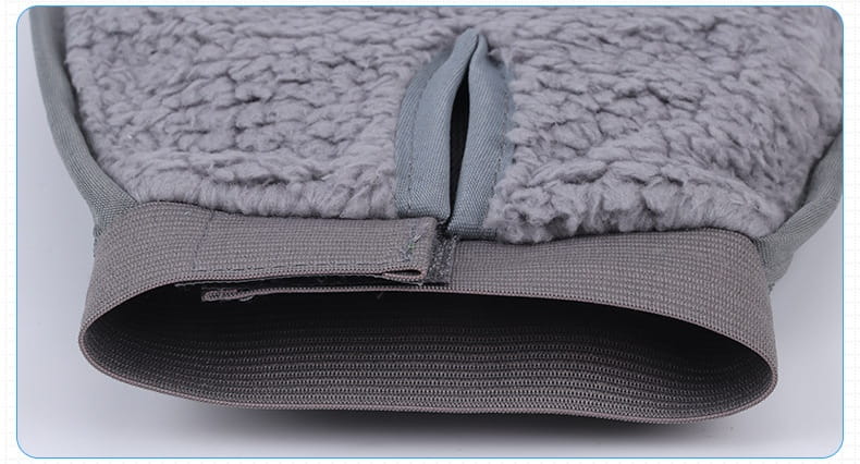 Gray fleece-lined pet grooming glove with silicone hair remover, ribbed elastic cuff, and zipper closure for bath brushing.