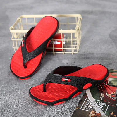 Men’s non-slip beach flip flops in red and black with a textured rubber sole and logo on the strap designed for cushioned comfort.