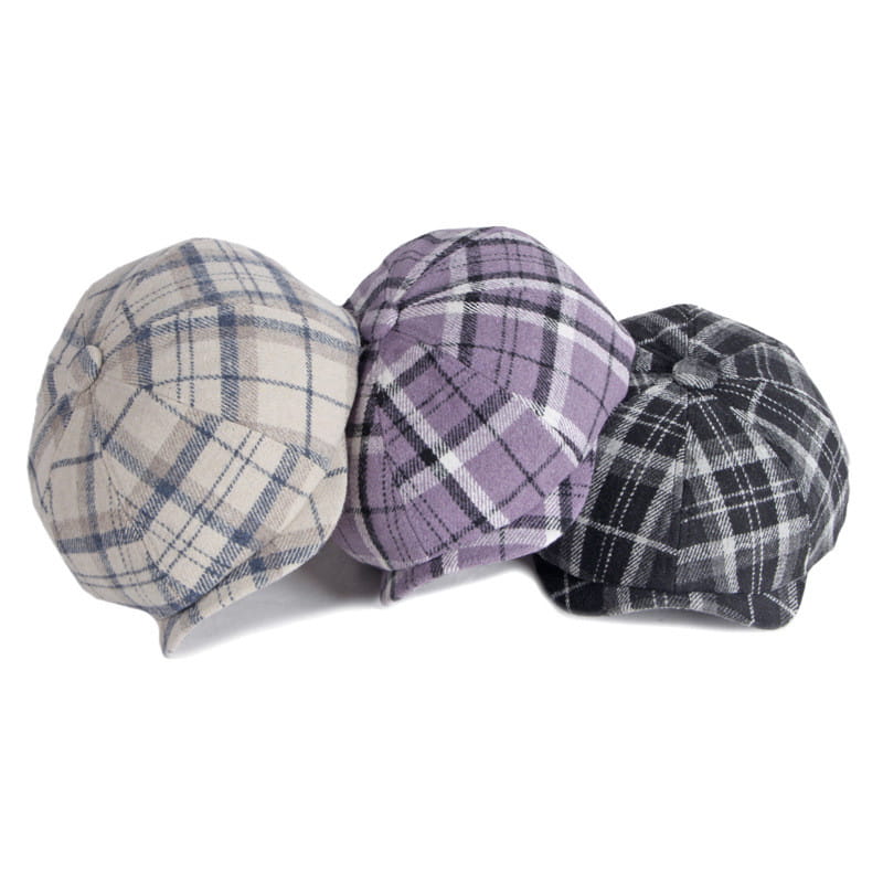 three plaid woolen octagonal hats for women in beige blue lavender purple and black and white patterns shown from the front.