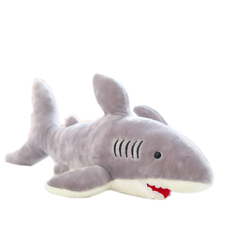 A plush gray shark toy with black eyes, a white underbelly, and red stitched teeth and gills designed as a soft and cuddly shark plush toy.