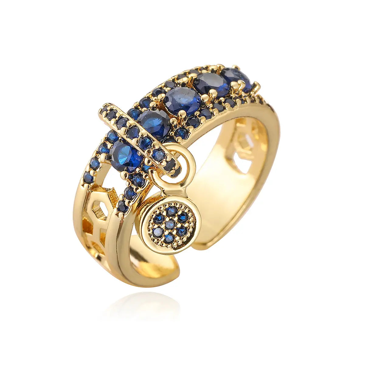 Adjustable geometric gold open ring featuring a band of deep blue round zircon stones and a dangling circular charm set with smaller blue zircons.