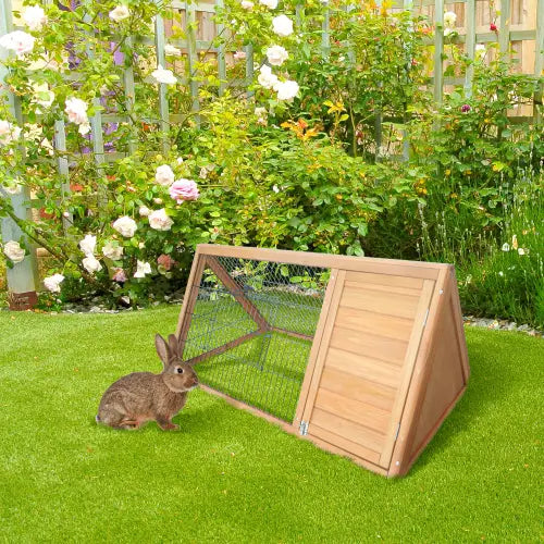 A wooden A-frame rabbit hutch with a slanted roof and wire mesh sides featuring a natural wood finish designed for outdoor small animal housing.