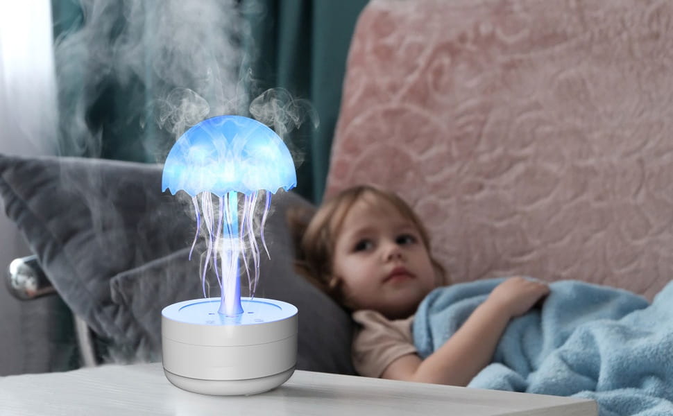 Blue glowing jellyfish humidifier with translucent tentacles and a white base featuring 7 color LED essential oil diffuser functionality.