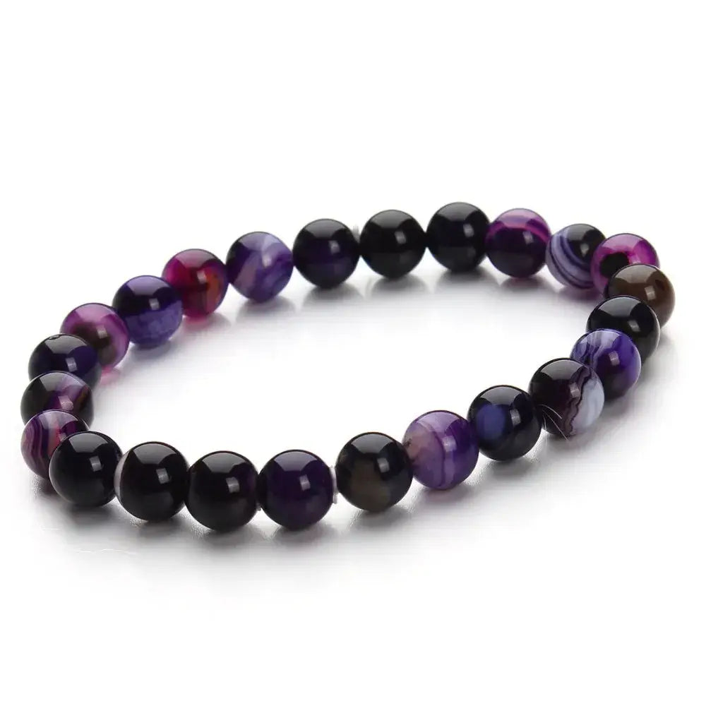 A natural polished gemstone and agate beaded bracelet featuring smooth round stones in deep purples and blacks with swirling patterns.