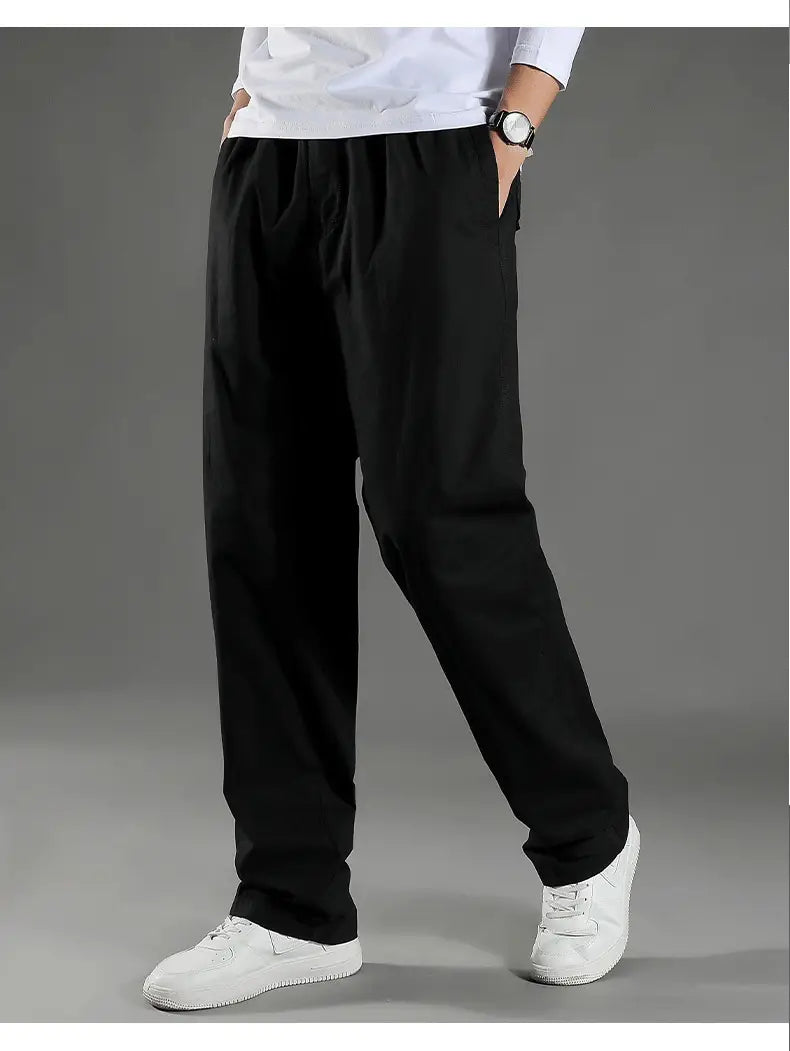 black loose-fitting men’s Japanese style cotton straight leg workwear pants with elastic waistband shown from the front
