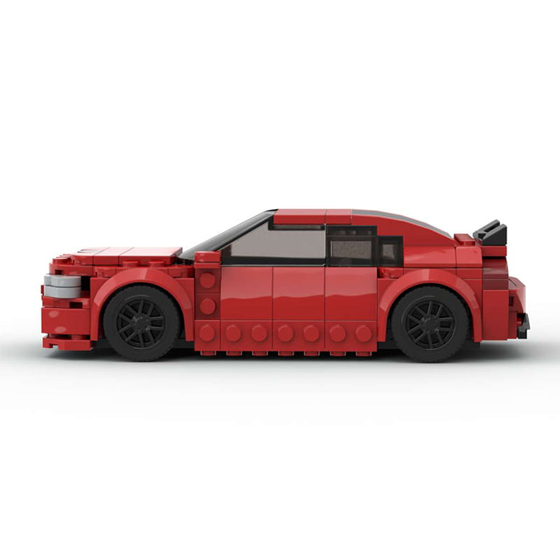 Red lego technic sports car model with black wheels and detailed body panels built from 249 building blocks.