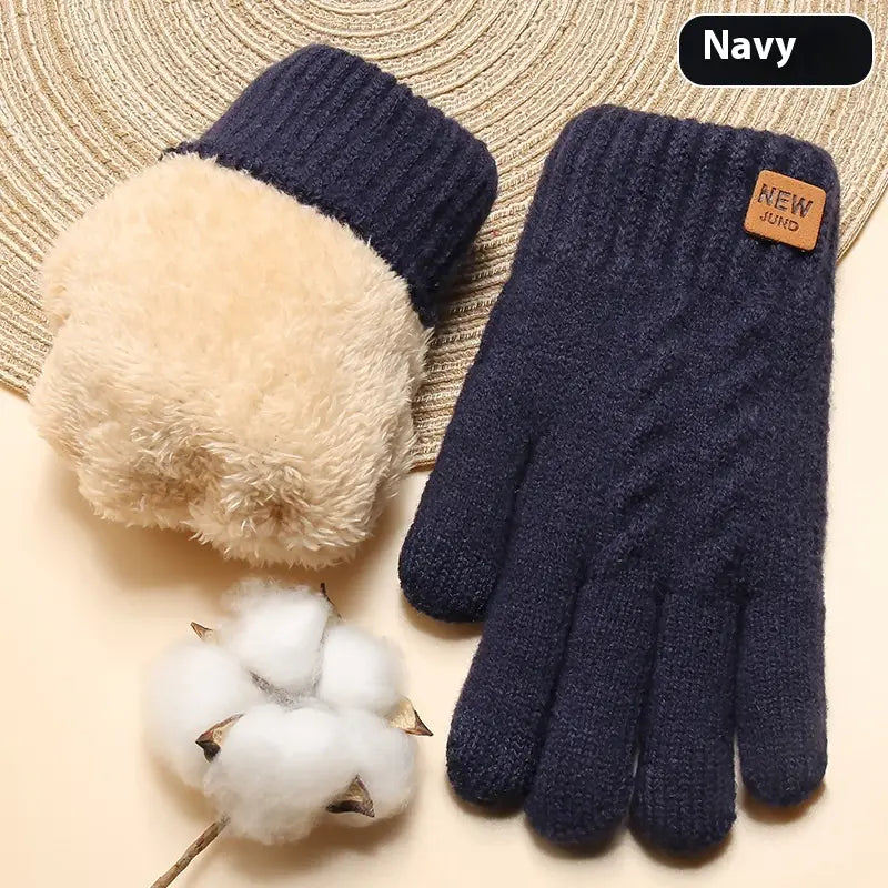 Navy blue knitted thermal touchscreen winter gloves for women with a plush beige interior and a small brown leather patch.