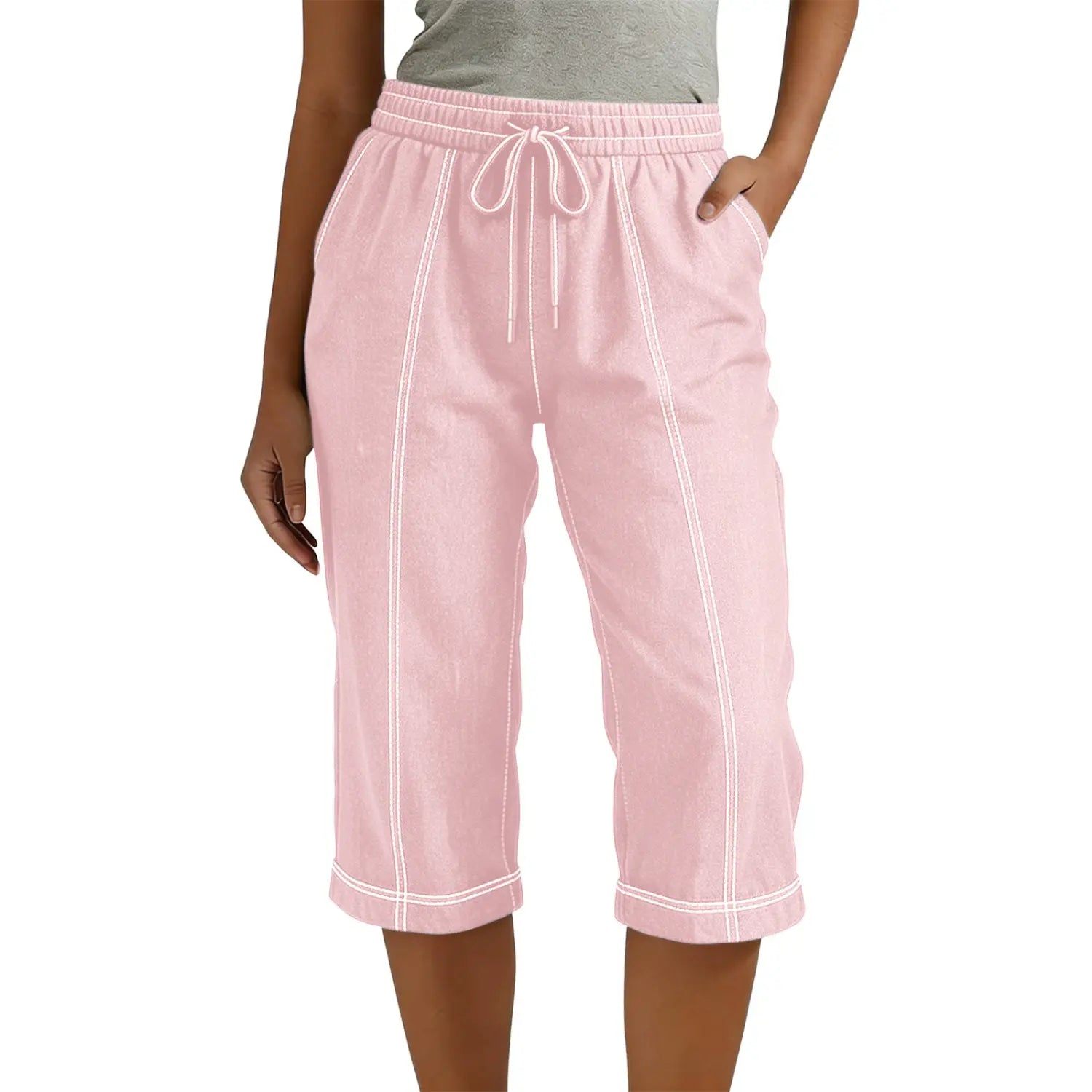 Capri-Hose in Rosa mit Kordelzug, mit weißen Ziernähten und lockerer, lässiger Passform für Damen.