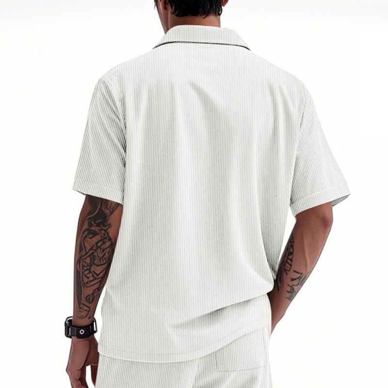 White loose corduroy short sleeve workwear shirt with fine vertical pinstripes and a contrasting black collar.
