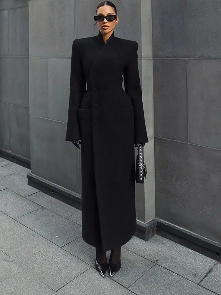 Black structured wool coat for women with dramatic shoulders and a high collar ideal for stylish outerwear.