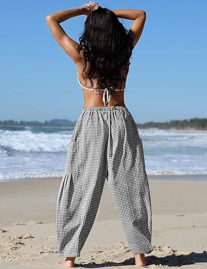 checkered harem pants wide leg drawstring trousers in black and white gingham check with a relaxed flowing silhouette.