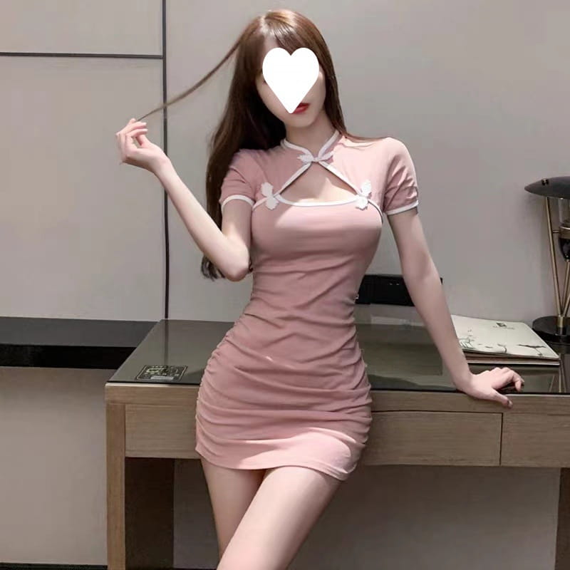 A pink short-sleeved vintage bow accent bodycon mini dress with white bow details at the neckline and sleeves.
