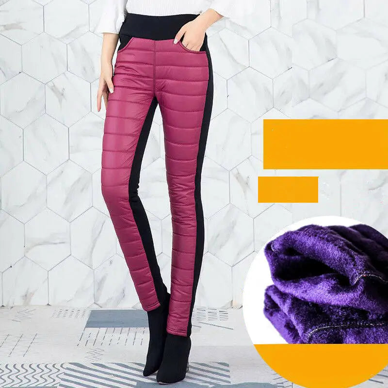 Pantalones tipo lápiz de invierno de cintura alta, forrados con felpa, en tela acolchada fucsia, con paneles laterales negros y forro de felpa morada.