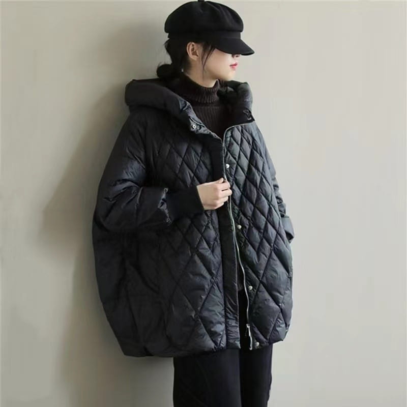 black quilted puffer coat with hood and button closures for winter wear made with white duck down filling