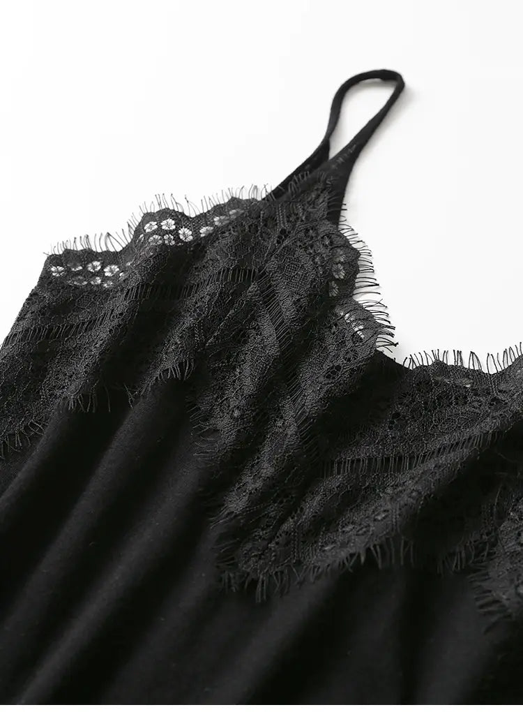 Black lace camisole top with delicate floral patterns and frayed edges made of lace trim material.