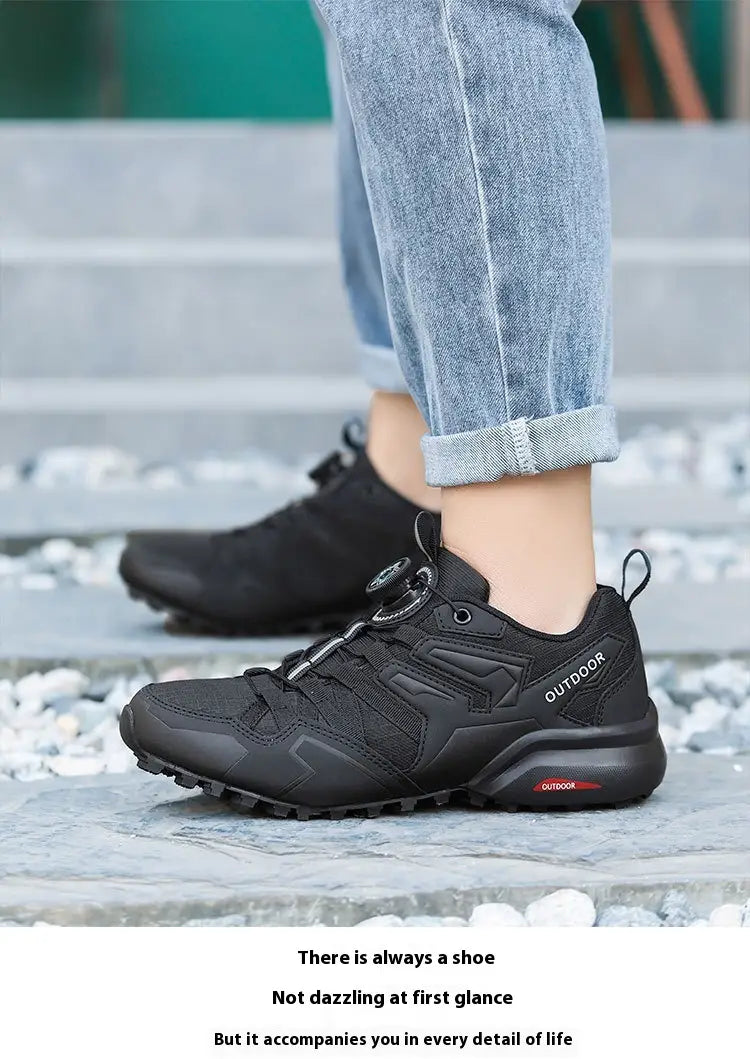 Black lightweight off-road hiking shoe with breathable textured mesh upper and rugged rubber sole for outdoor use.