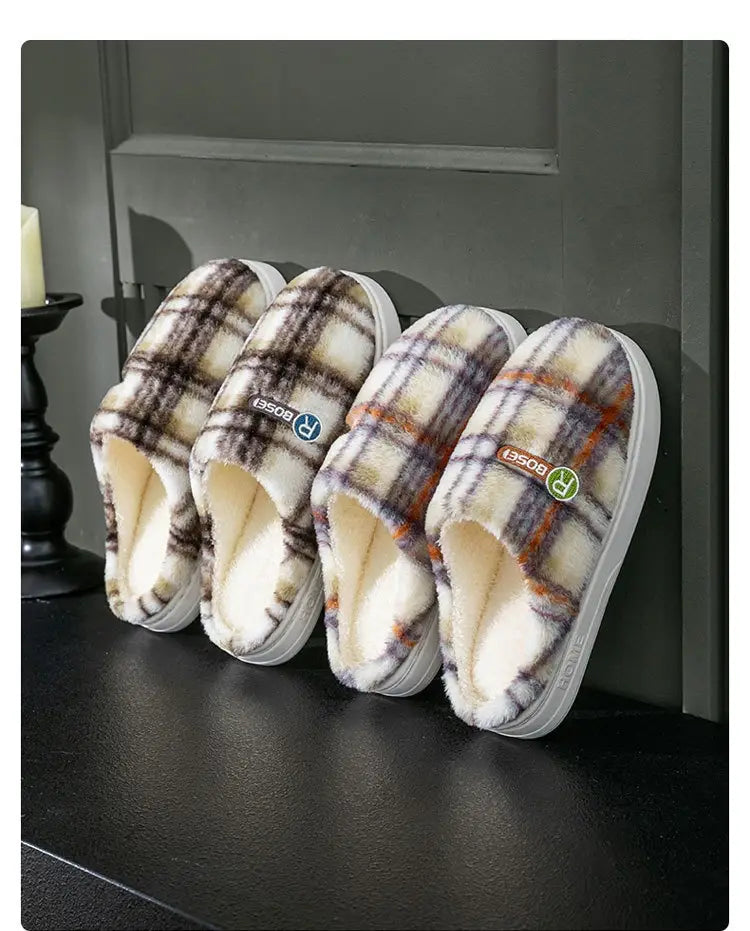 Unisex plaid fleece lined indoor slippers with white rubber soles and a soft cozy interior designed for non slip use.