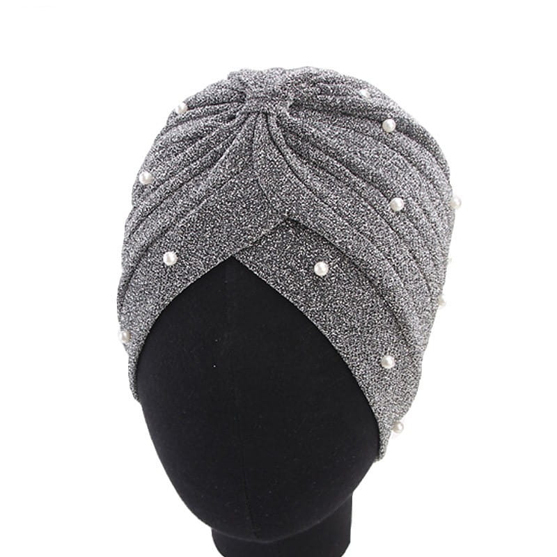 Silver glittery turban hat adorned with white pearls made of shimmering jacquard fabric for women