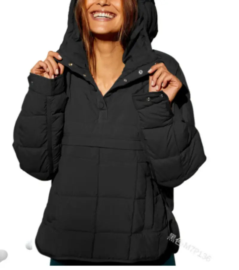Black quilted hooded puffer jacket for women featuring a front pocket and warm insulated material.