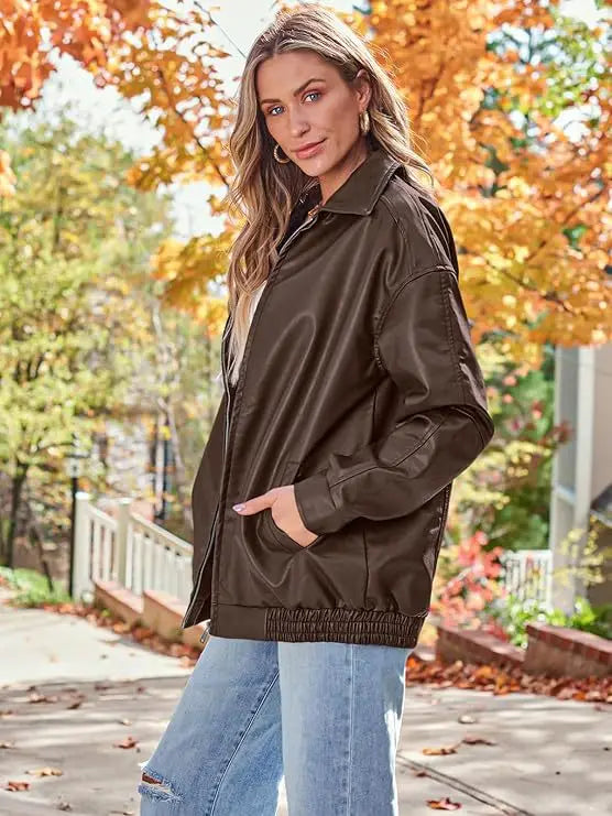 brown faux leather bomber jacket with oversized relaxed fit and elasticized waistband shown from the back side