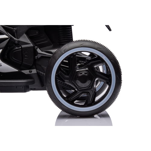 Black 6v kids electric ride on motorcycle with glossy finish and silver-rimmed wheels shown from the back side.