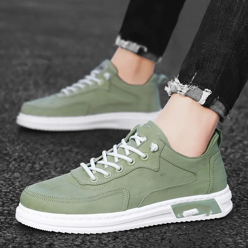 Olive green suede low-top canvas sneakers with white laces and a translucent air cushion sole designed for trendy casual sports use.