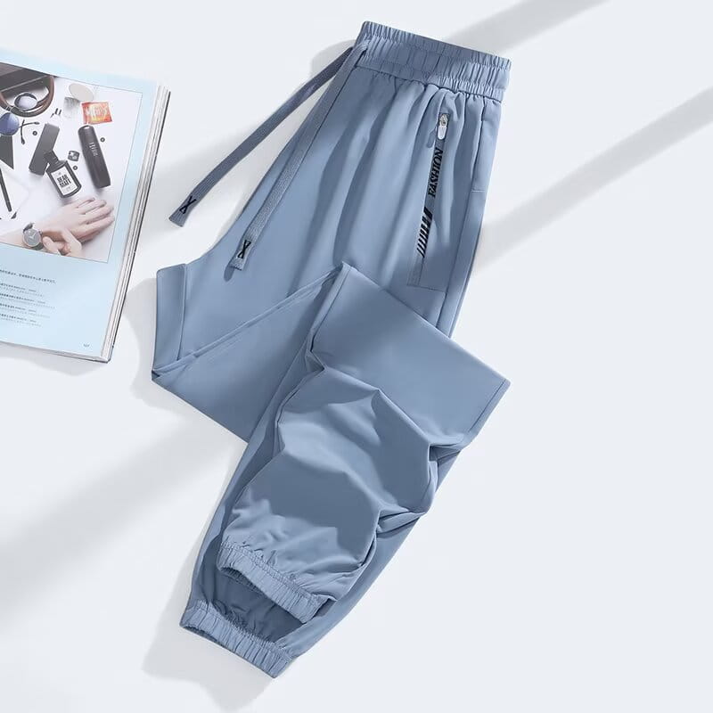 Light blue anti-mosquito casual athletic trousers with elastic waistband drawstring and a side pocket featuring black zipper detailing.
