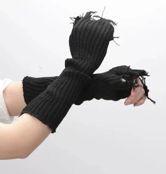 Black tattered knit fingerless gloves unisex made of black ribbed knit fabric featuring frayed distressed edges.