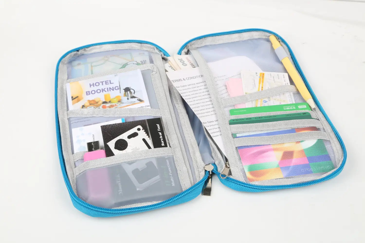 Blue zippered waterproof Oxford fabric travel passport and document wallet with clear plastic pockets and gray interior holding various documents cards and small items.
