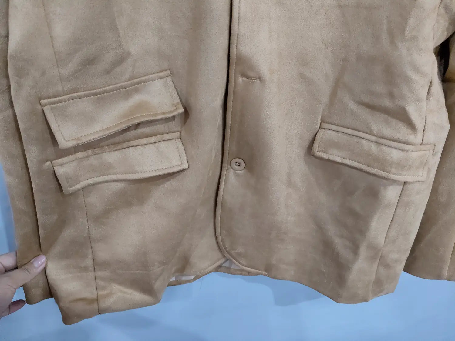 Men’s brown suede business casual blazer jacket in beige with flap pockets and a single button closure.